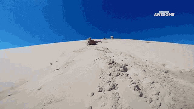 a picture of a sand dune with the words awesome on the top