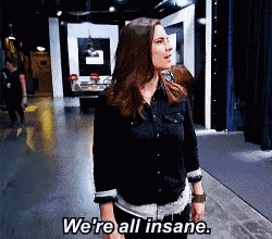 a woman says we 're all insane in a room