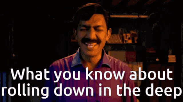 a man in a purple shirt is laughing with the words " what you know about rolling down in the deep " below him