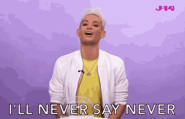 a man says i 'll never say never in front of a pink background