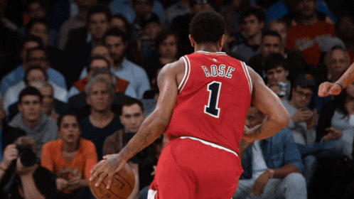 a basketball player wearing a red jersey with the number 1 on it