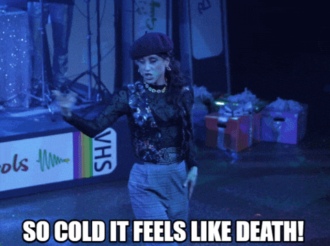 a woman on stage with the words so cold it feels like death written below her