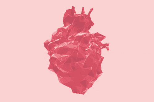 a low poly heart made of triangles on a pink background .