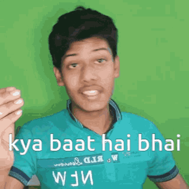 a young man wearing a blue shirt with the words " kya baat hai bhai " written on it