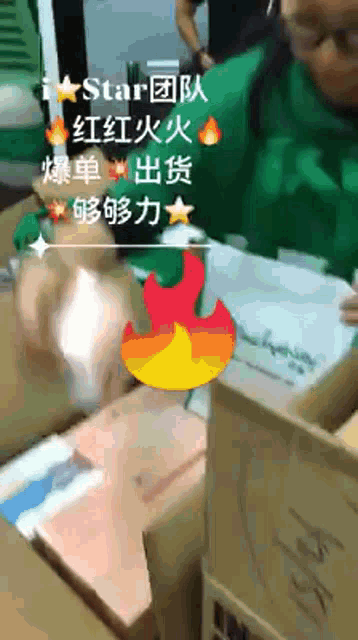 a person in a green shirt is sitting at a table with boxes in front of a sign that says " star "