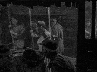 a black and white photo of a group of people