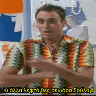 a man in a colorful shirt is talking in a foreign language with a caption in another language