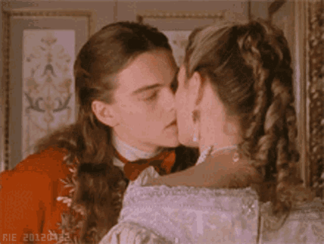 a man and a woman are kissing with the year 2012 on the bottom