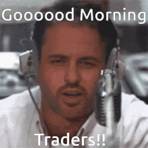 a man wearing headphones says " good morning traders "