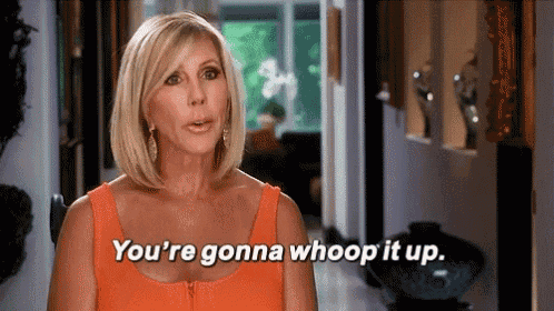 a woman is standing in a hallway and saying `` you 're gonna whoop it up '' .