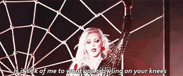 a woman is standing in front of a spider web and says is it sick of me