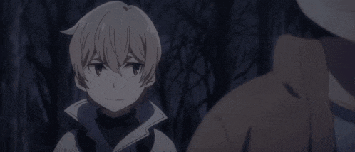 a man and a boy are standing next to each other in a dark room