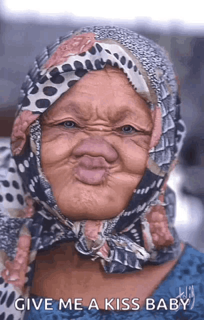 an older woman wearing a scarf around her head is making a funny face and asking for a kiss .