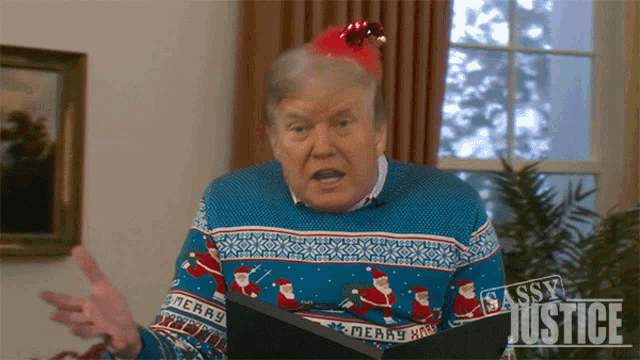 a man wearing a sweater that says merry on it