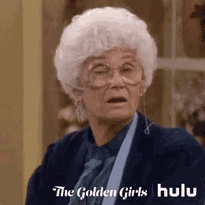 an older woman wearing glasses and a wig is making a surprised face .