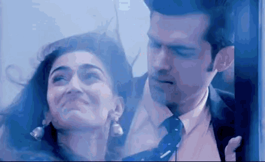 a man and woman are standing next to each other