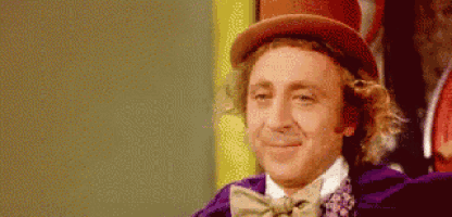 a close up of a man wearing a top hat and a bow tie .
