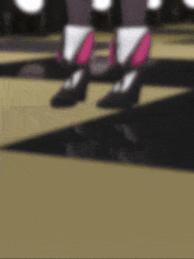 a blurred image of a person 's feet with pink shoes