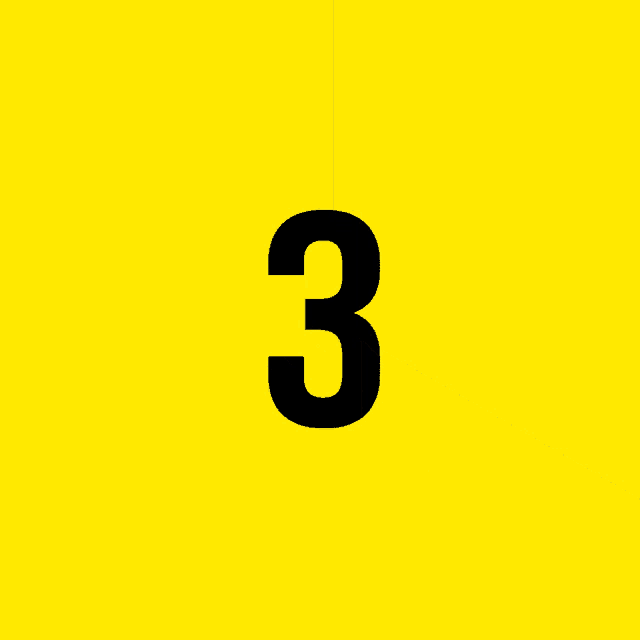 a black and yellow triangle with a yellow letter g on it
