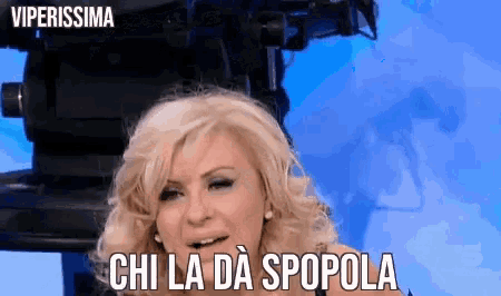 a woman in front of a camera with the words " viperissima " on the bottom right