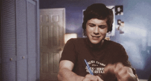 a man wearing headphones and a shirt that says chris superstar on it