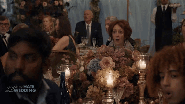 a group of people sitting at a table with the words people we hate at the wedding written on the bottom