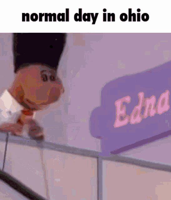 a cartoon character is standing on a balcony in front of a sign that says edna .