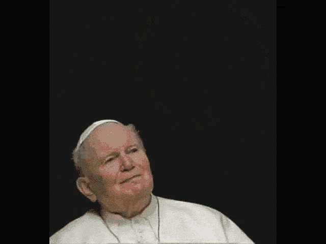 an elderly man looks up at a picture of an explosion in the background