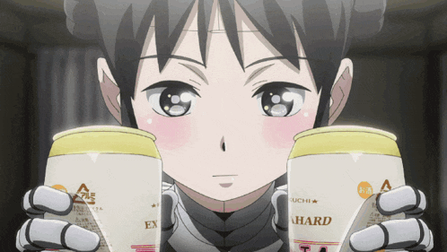 a girl is holding up two cans of a hard drink