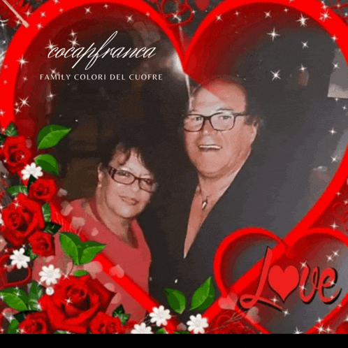 a picture of a man and woman surrounded by red roses and a red heart with the word love on it