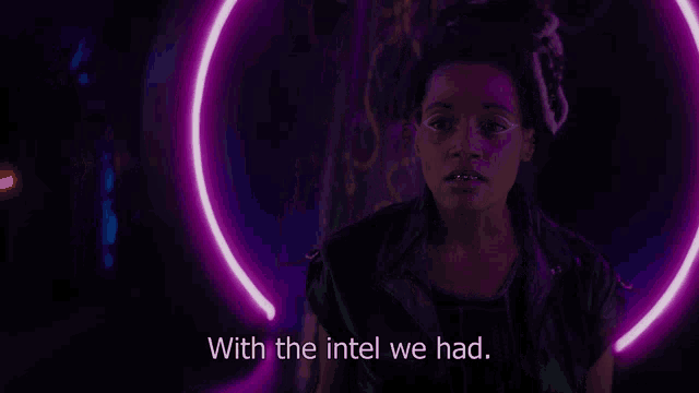 a woman stands in front of a purple light with the words with the intel we had below her