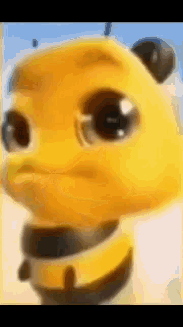 a close up of a yellow cartoon character 's face