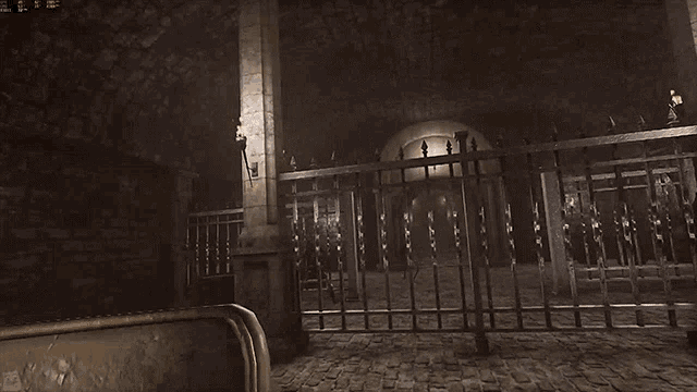 a dark room with a fence and a brick wall