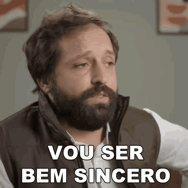 a man with a beard has the words vou ser bem sincero on his chest