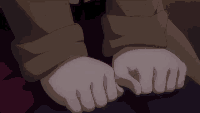 a close up of a person 's hands with a ring on