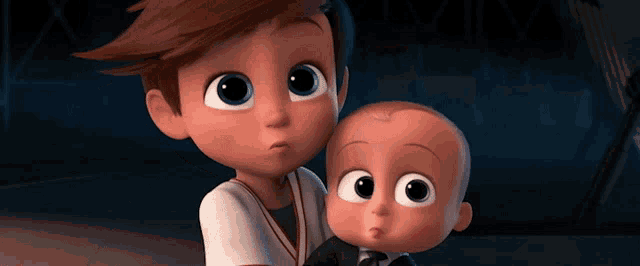 a boy and a baby are standing next to each other and looking at the camera
