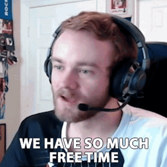 a man wearing headphones and a microphone says " we have so much free time "