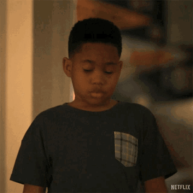 a young boy in a black shirt says great in white letters