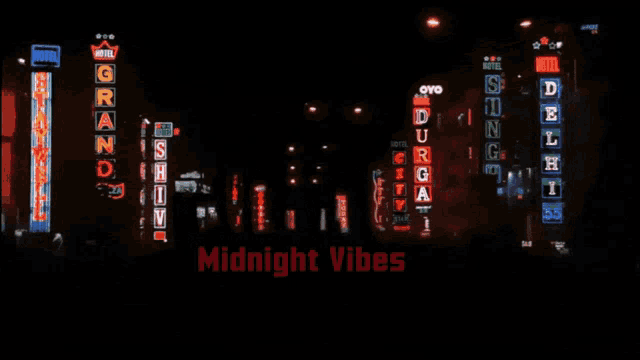 a sign that says midnight vibes is lit up in the dark