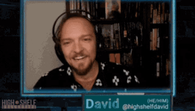 a man wearing headphones is on a screen with the name david on it