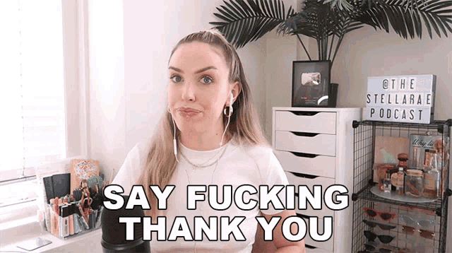 a woman says " say fucking thank you " in front of a sign for the stellarae podcast