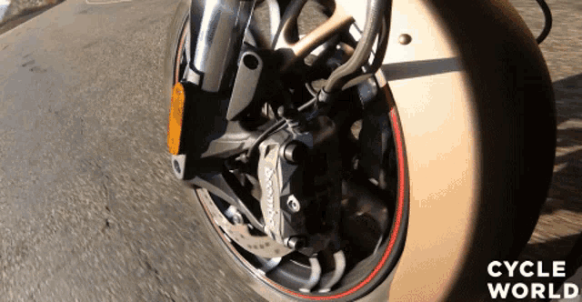 a close up of a motorcycle wheel with cycle world written on the bottom