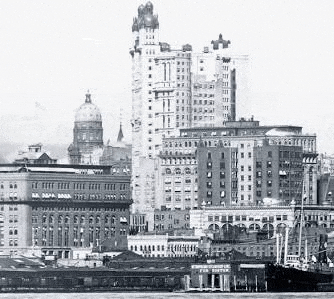 a black and white photo of a city skyline with a ship in the foreground .