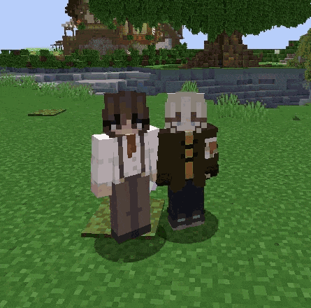 two minecraft characters standing next to each other in a grassy field