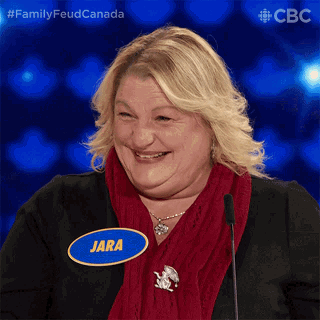 a woman with a blue name tag that says jara