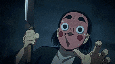 a close up of a person wearing a mask with big eyes and circles on it .