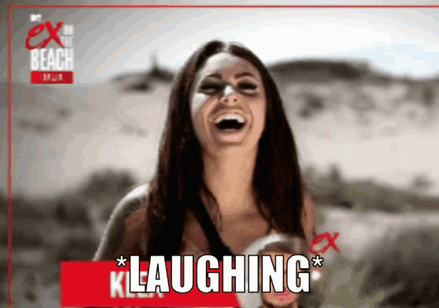 a woman is laughing in front of a sign that says klaughing