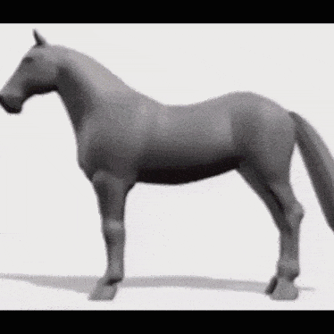 a gray horse is standing on a white surface .