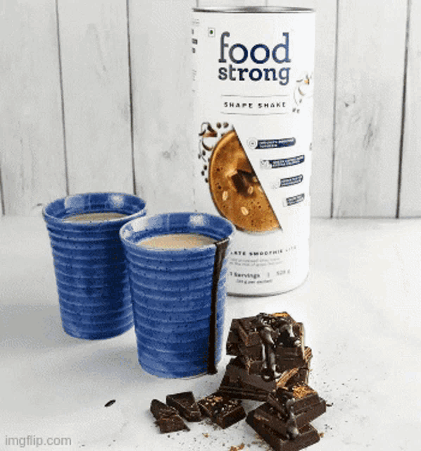 two cups of coffee next to a food strong shake