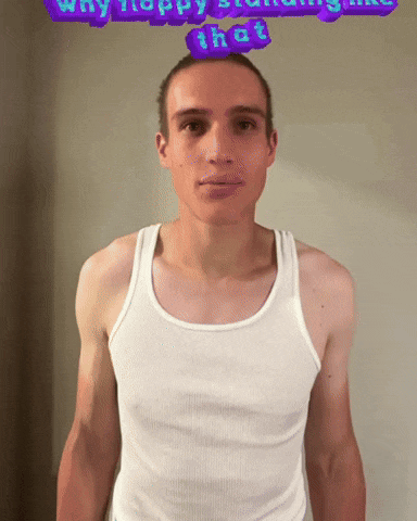 a man in a white tank top stands in front of a purple sign that says why happy standing like that